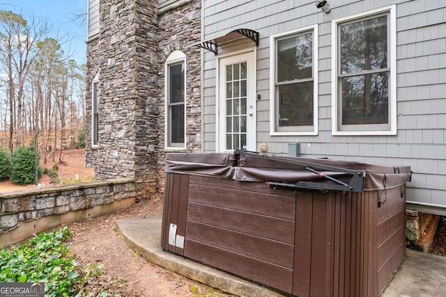 view of patio / terrace with a hot tub