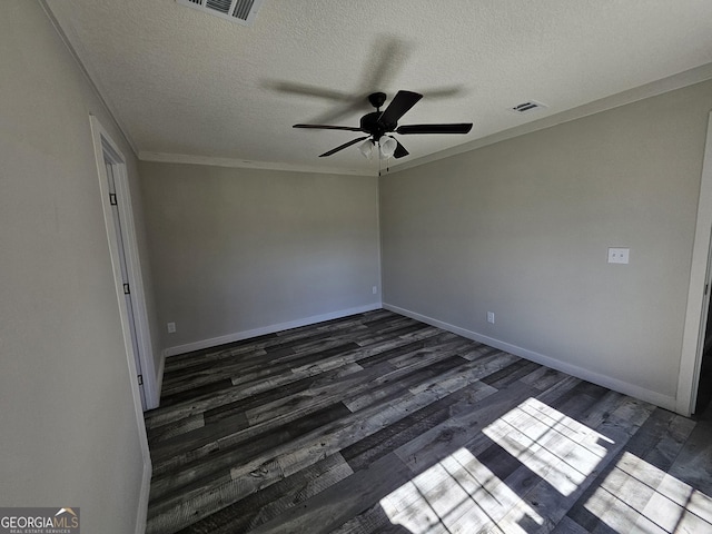 unfurnished room with crown molding, baseboards, visible vents, and dark wood-style flooring