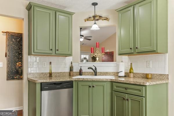 kitchen with dishwasher, tasteful backsplash, green cabinetry, and a sink