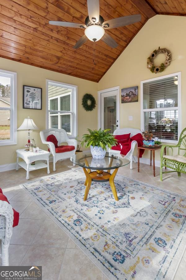 living room with tile patterned flooring, baseboards, ceiling fan, vaulted ceiling, and wooden ceiling