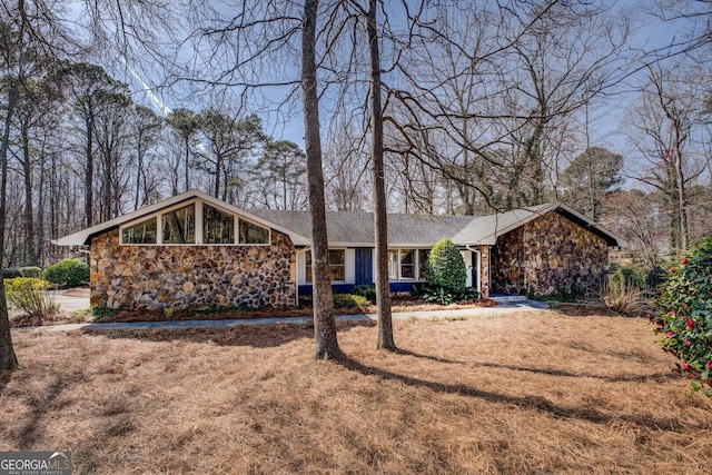 view of front facade featuring stone siding