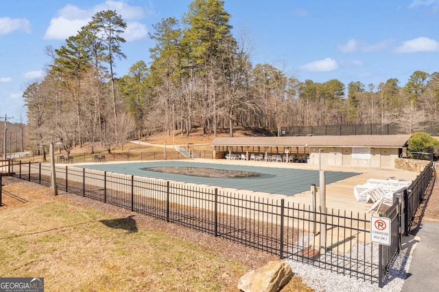 view of pool with fence