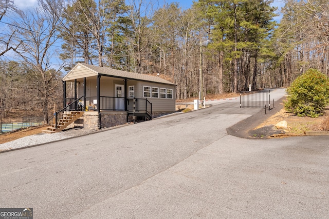 exterior space featuring a porch and driveway