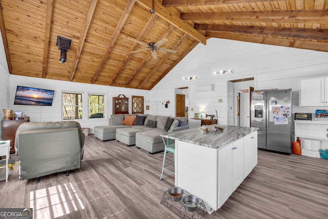 living area featuring wood finished floors and wooden ceiling