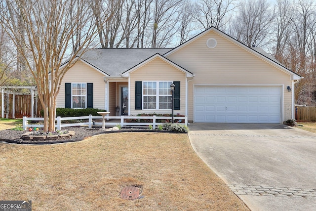 ranch-style home with concrete driveway, a front yard, a garage, and a fenced front yard