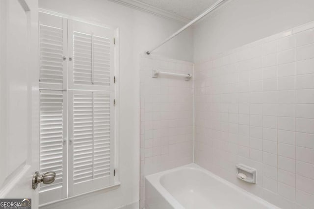 full bathroom with  shower combination and ornamental molding