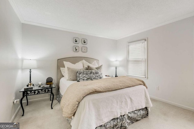 carpeted bedroom featuring ornamental molding, baseboards, and a textured ceiling