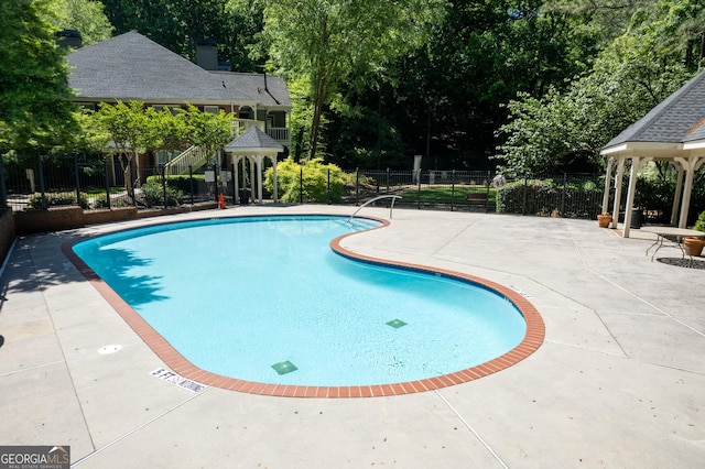402 Bainbridge Dr, Atlanta, GA 30327 - community pool with a gazebo, a patio, and fence