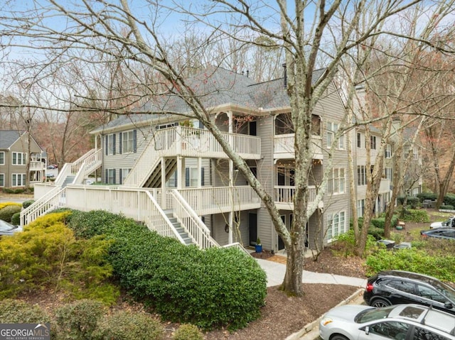 402 Bainbridge Dr, Atlanta, GA 30327 - view of property featuring stairway and uncovered parking