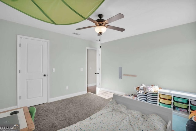 carpeted bedroom featuring visible vents, ceiling fan, and baseboards