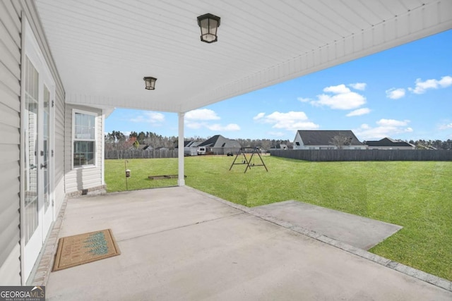 view of patio featuring fence