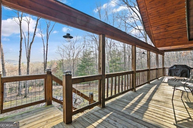 wooden deck with grilling area