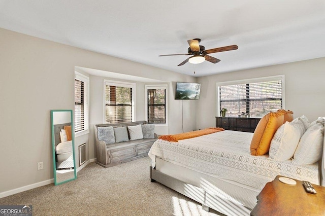 carpeted bedroom with baseboards and ceiling fan