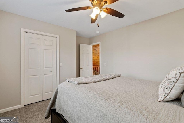 carpeted bedroom featuring a closet and ceiling fan