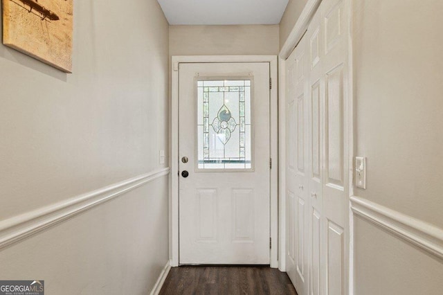 entryway featuring dark wood-style floors and wainscoting