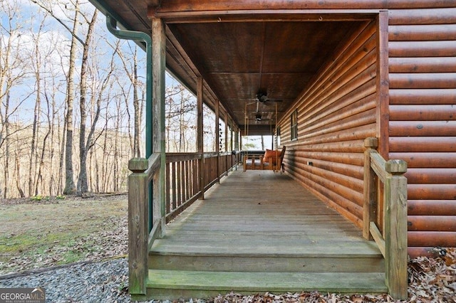 wooden deck featuring ceiling fan