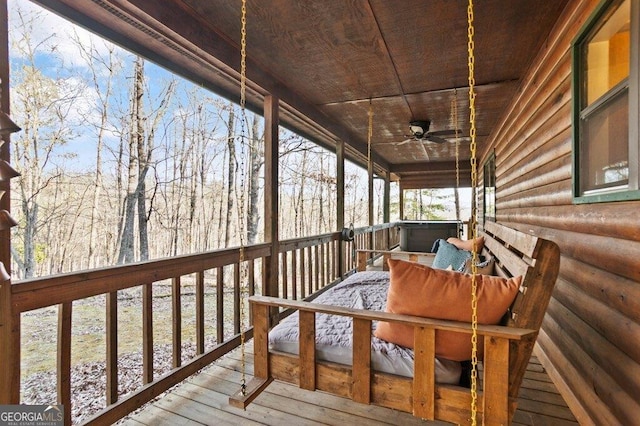 wooden deck featuring ceiling fan