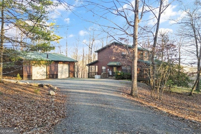 view of road featuring gravel driveway