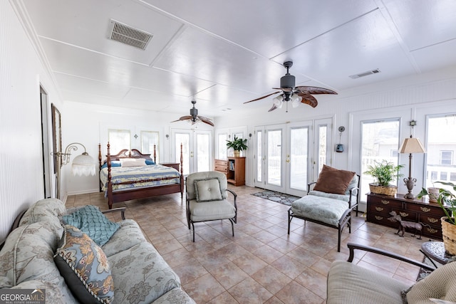 tiled bedroom with access to exterior, french doors, visible vents, and ceiling fan