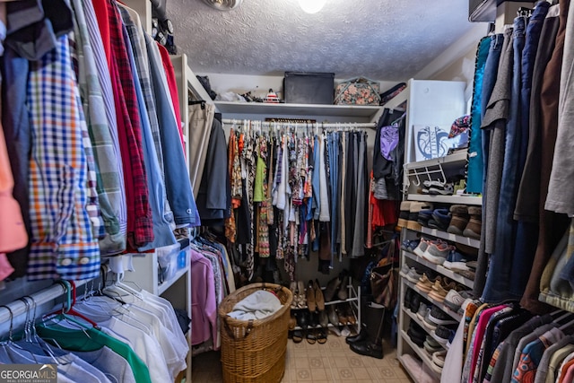 spacious closet featuring tile patterned floors