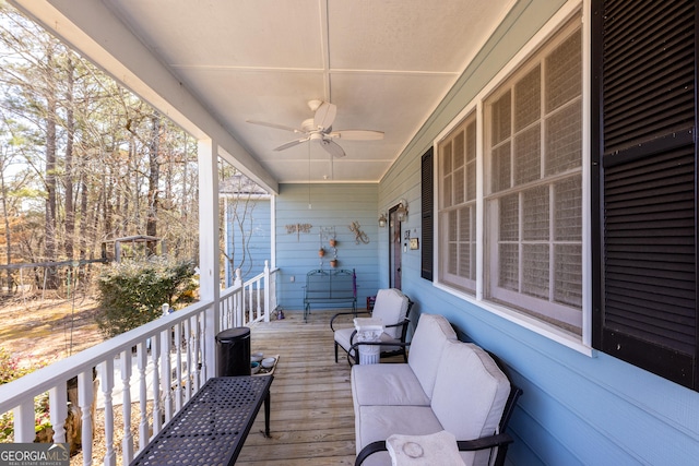 wooden terrace with ceiling fan