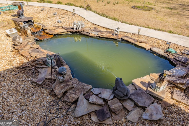 exterior space featuring a small pond