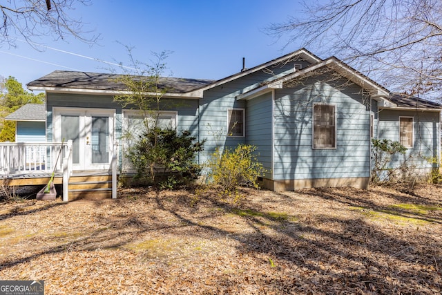 view of home's exterior featuring a wooden deck