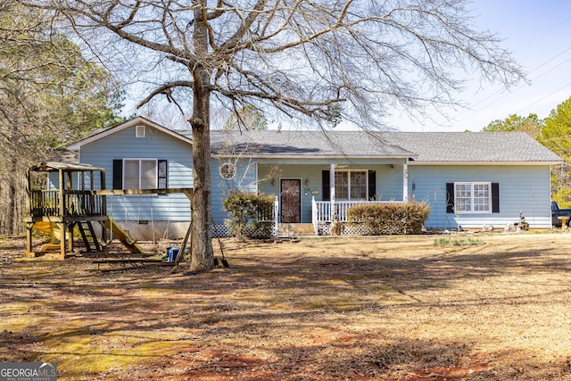 ranch-style house with crawl space, roof with shingles, and covered porch