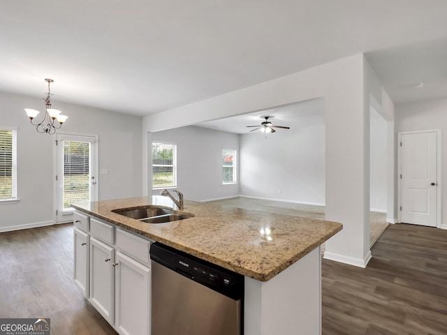 kitchen with a sink, dishwasher, hanging light fixtures, white cabinetry, and dark wood-style flooring