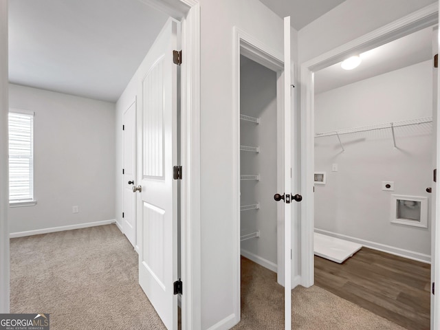 interior space featuring baseboards and carpet