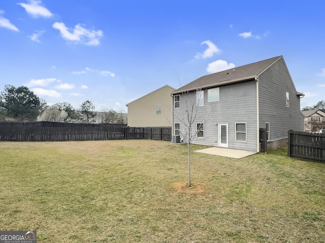 back of house with a lawn, central AC, a patio, and fence