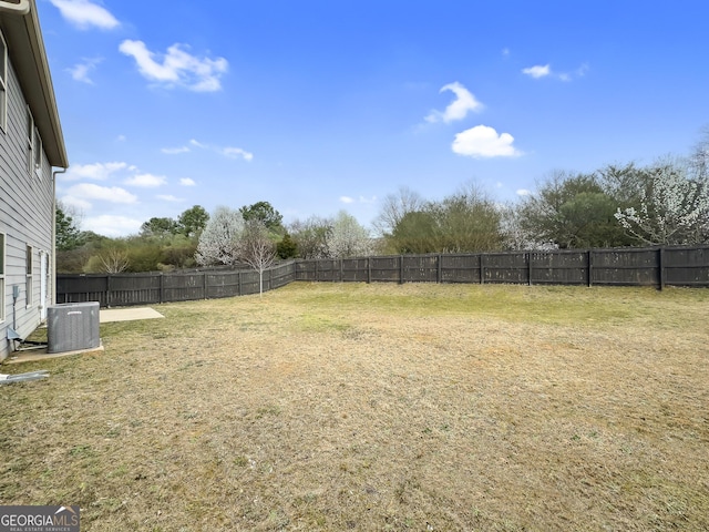 view of yard featuring cooling unit and a fenced backyard