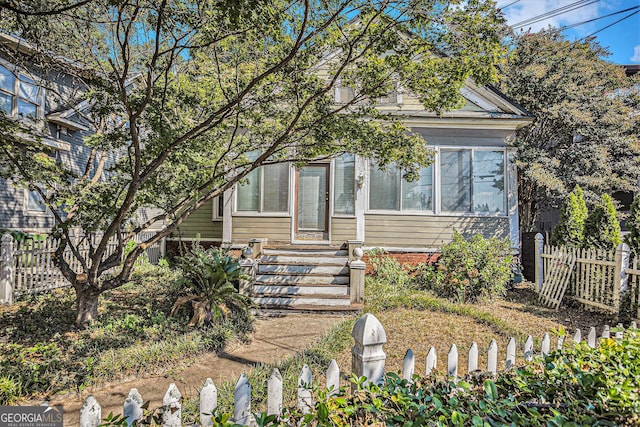 view of front of house with fence