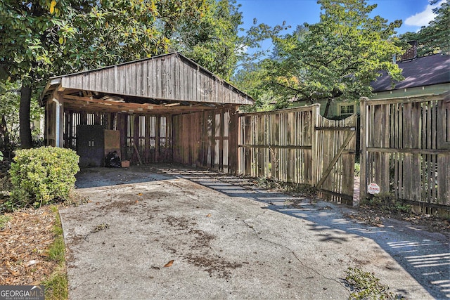 exterior space featuring fence and a gate