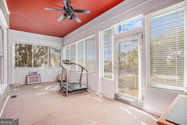 workout area with visible vents, wood ceiling, a ceiling fan, and a sunroom