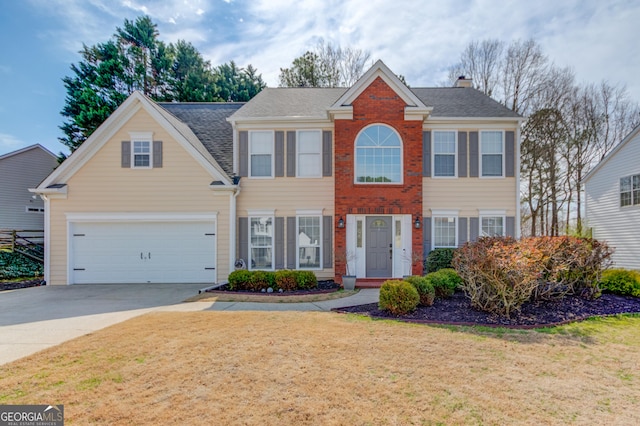 colonial inspired home with concrete driveway and a front yard