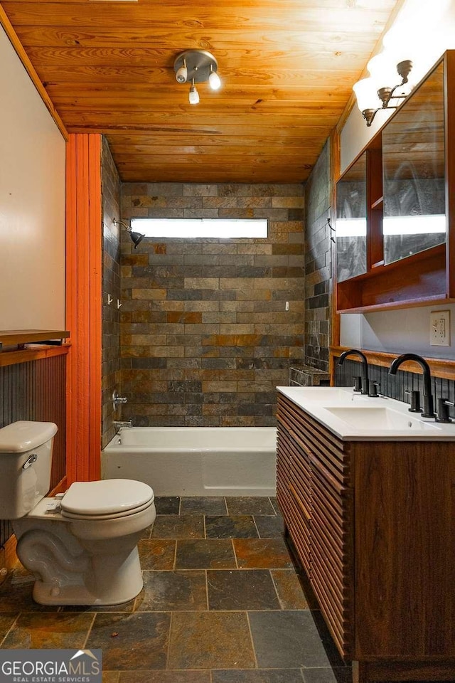 bathroom with vanity, toilet, wood ceiling, and stone tile flooring