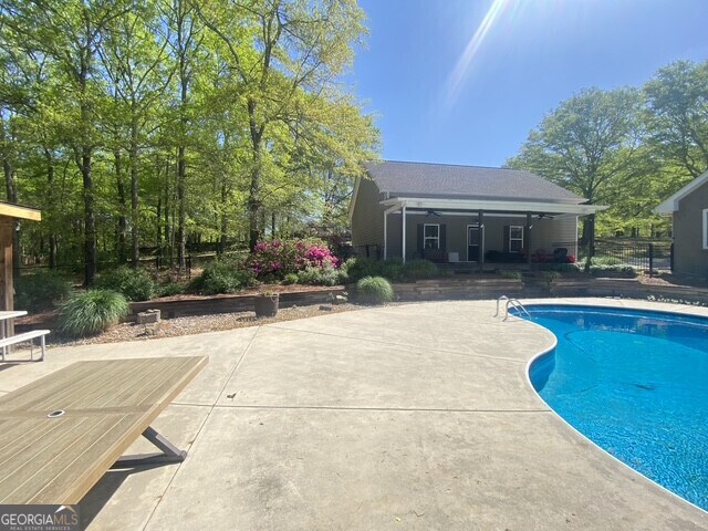 swimming pool featuring a patio