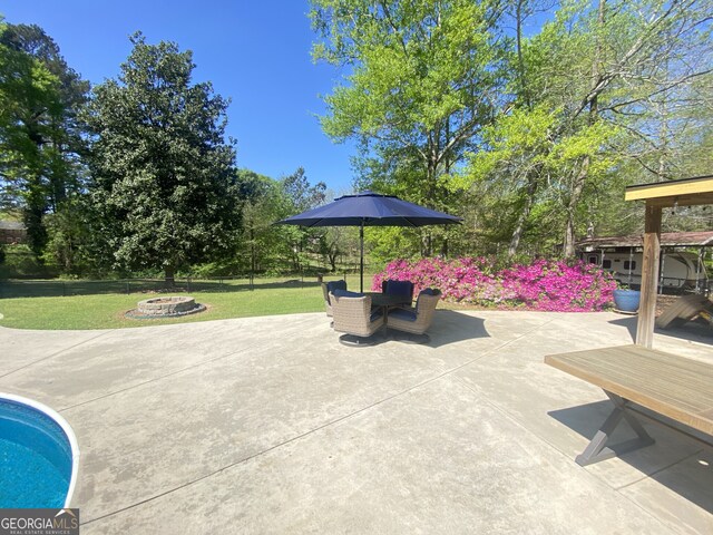 view of patio / terrace with an outdoor fire pit