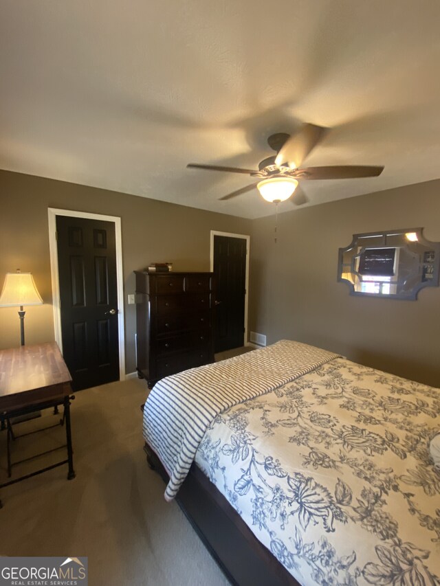 carpeted bedroom featuring a ceiling fan
