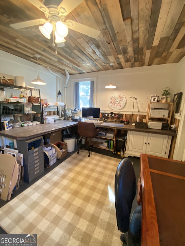 office featuring light carpet, built in desk, ceiling fan, and wood ceiling