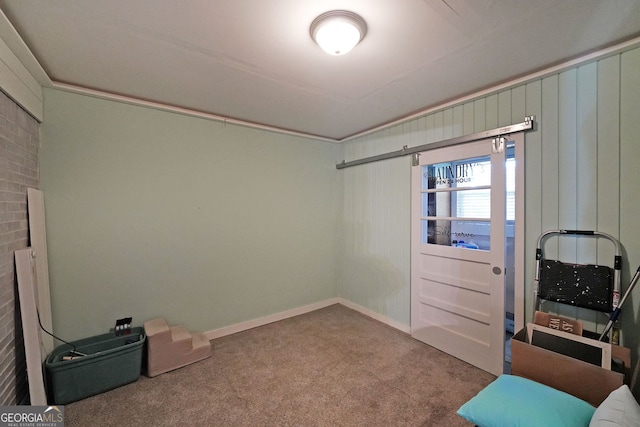 sitting room featuring baseboards and carpet flooring