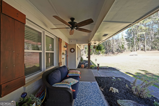 view of patio with a ceiling fan and visible vents