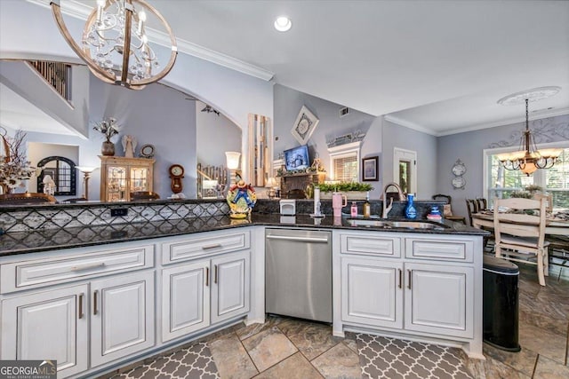 kitchen featuring a sink, ornamental molding, white cabinets, stainless steel dishwasher, and a chandelier