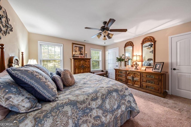 carpeted bedroom featuring a ceiling fan