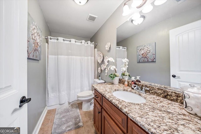 bathroom with visible vents, baseboards, toilet, tile patterned floors, and vanity