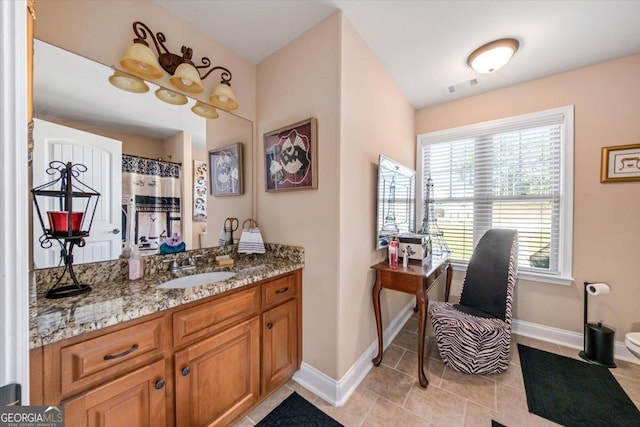 full bathroom with vanity, tile patterned floors, baseboards, and visible vents