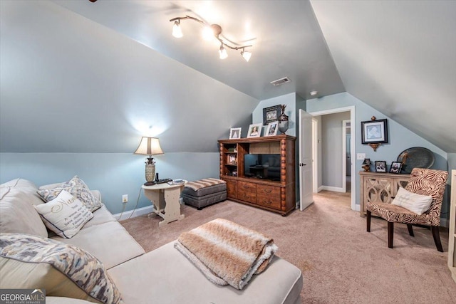 living room with vaulted ceiling, carpet, visible vents, and baseboards