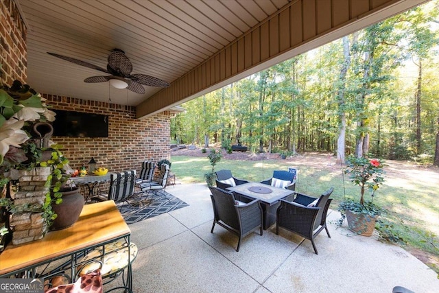 view of patio / terrace with outdoor dining area and ceiling fan