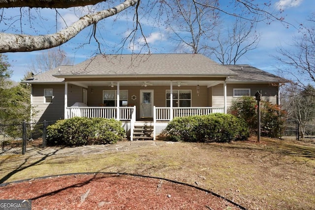 view of front of house featuring a ceiling fan, a porch, a gate, and fence